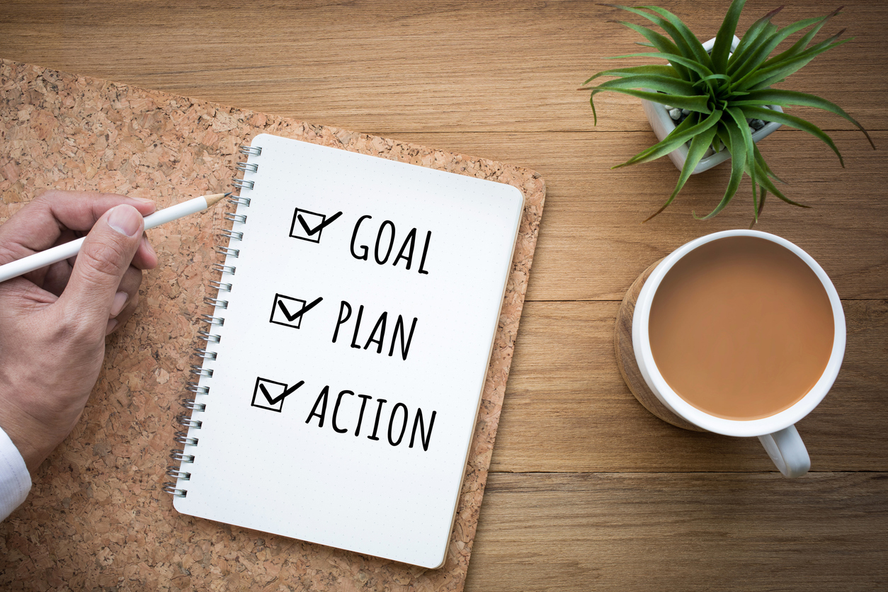 Notepad with checklist of Goal, Plan, Action
